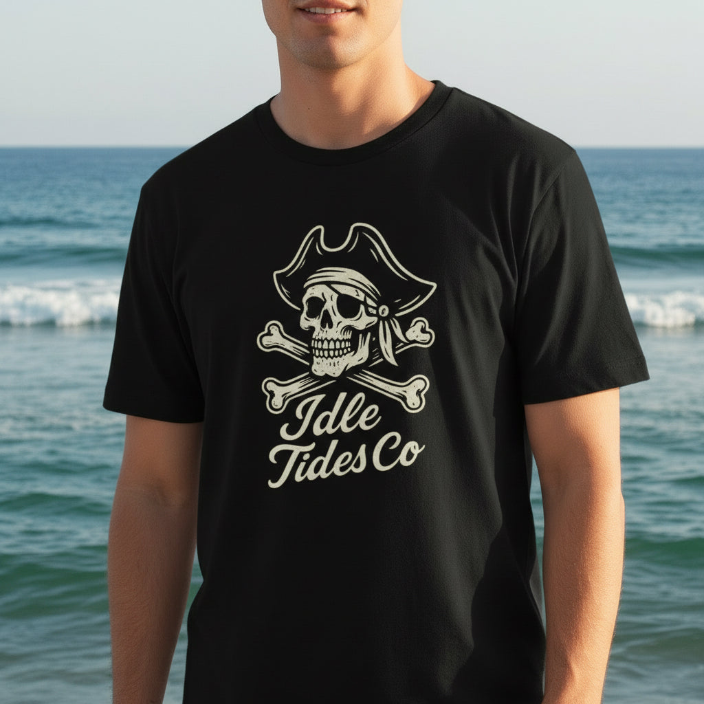 Idle Tides Co Skull and Crossbones crewneck tee in black featuring embroidered pirate skull with tricorn hat above crossed bones; relaxed fit, nautical badge design.